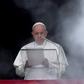 Pope Francis stands at the window of the Apostolic Palace overlooking St Peter's square in the Vatican