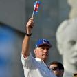 Miguel Diaz-Canel's (L) first year as president of Cuba has been anything but straightforward