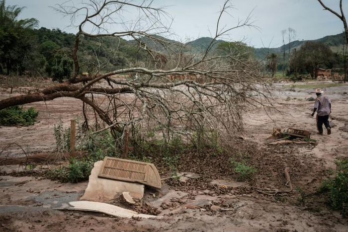 A Brazilian farmer (pictured October 2016) walks through the Paracatu de Baixo village, which was ruined by the flood following the collapse of Brazilian mining company Samarco's iron ore waste reservoir in 2015