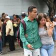 Families of prisoners who died in a riot in a police station jail wait in front of a morgue in Acarigua, Venezuela on May 25, 2019