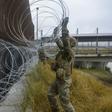 US troops lay concertina wire along the Gateway International Bridge in Brownsville, Texas