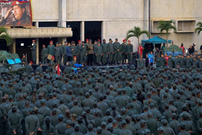 This handout picture released by the presidency shows Venezuela's Nicolas Maduro addressing troops after a failed military uprising