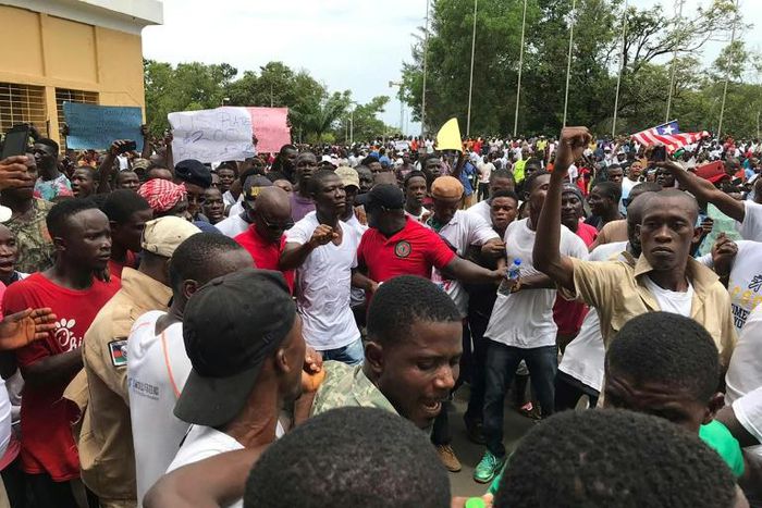 The protest was led by lawmaker Yeke Korlubah (centre, in white shirt), one of Weah's most vociferous critics