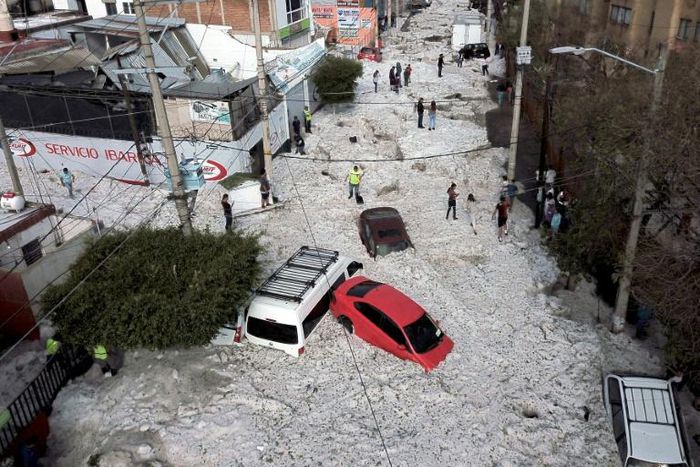 A freak heavy hail storm damaged buildings and buried cars and trucks in the area around Guadalajara, Mexico