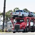 A truck loaded with vehicles enters the US at the Otay Mesa port of entry at the US-Mexico border in San Diego, California on June 8, 2019