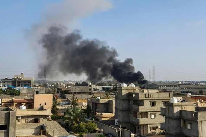 Plumes of smoke rise from the Tripoli suburb of Tajoura after it was hit by an air strike launched by forces loyal to Libya strongman Khalifa Haftar