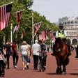 Mounted police officers patrol near Buckingham Palace, with both the US flag and the Union Jack flying as London and the royal family prepare a bit warily for a pomp-filled visit by US President Donald Trump