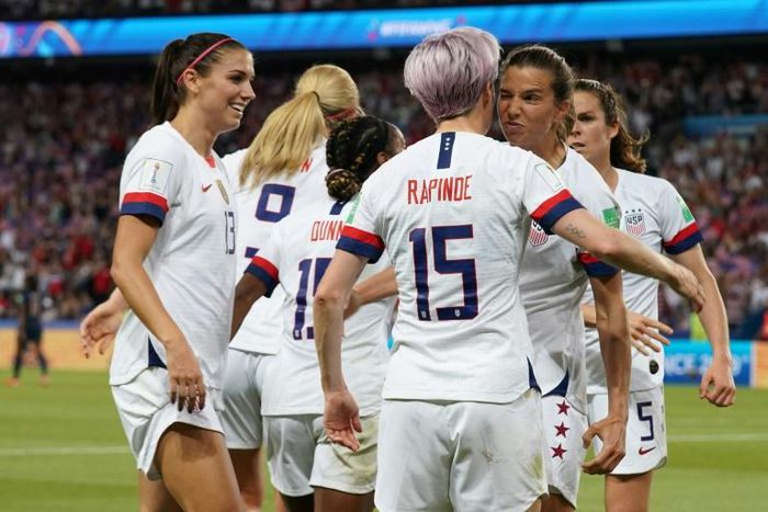 USA players celebrate with number 15 Megan Rapinoe after she scored in the 2-1 win over hosts France in the World Cup quarter-final