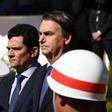 Brazilian President Jair Bolsonaro (R) and his Justice Minister Sergio Moro, who is under fire over accusations he acted improperly as a judge in a sprawling corruption case