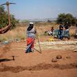 People take part in a land grabbing action near Johannesburg as the government embraces enforced land reform as a flagship policy