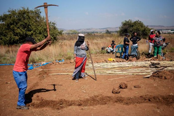 People take part in a land grabbing action near Johannesburg as the government embraces enforced land reform as a flagship policy