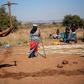 People take part in a land grabbing action near Johannesburg as the government embraces enforced land reform as a flagship policy