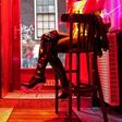 Amsterdam's mayor has proposed drawing curtains over the notorious glass-fronted booths where sex workers ply their trade