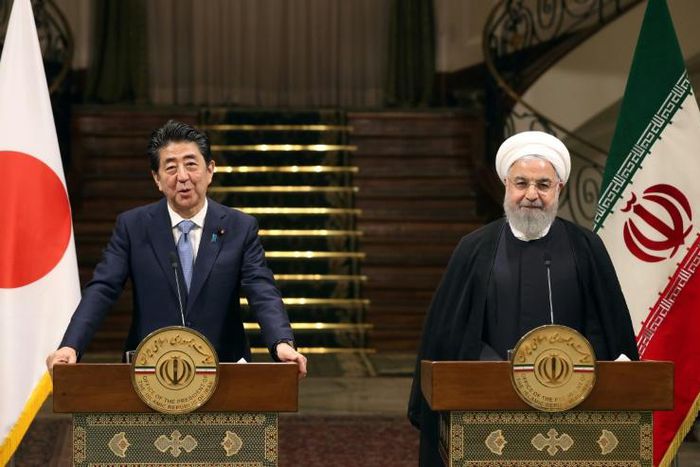 Iranian President Hassan Rouhani and Japanese Prime Minister Shinzo Abe give a joint press conference at the Saadabad Palace in Tehran