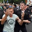 Opposition leader Alexei Navalny is detained by Russian police officers during a Moscow march to protest against polie abuse