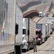 Facing five percent tariffs: Cargo truck drivers line up to cross to the United States at Otay commercial crossing in Tijuana, Mexico