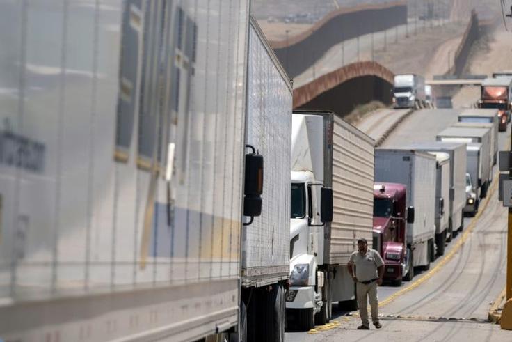 Facing five percent tariffs: Cargo truck drivers line up to cross to the United States at Otay commercial crossing in Tijuana, Mexico