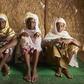 Vellara Barry, 45, Dienaba Barry 43, and Fatoumata Ousmane Barry 45, pictured in May after taking refuge in a displaced persons camp in Bamako amid a spate of violent attacks which have killed dozens