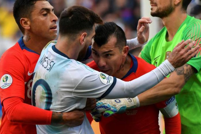 Lionel Messi (second from left) appeared to do nothing wrong as Gary Medel (second from right) tried to headbutt him after a clash