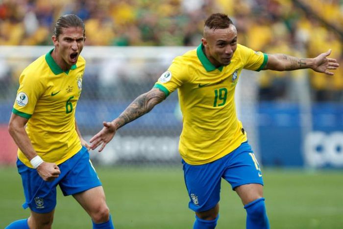 Brazil's flying winger Everton (right) celebrates scoring his second international goal, against Peru at the Copa America