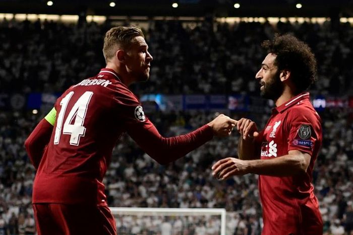 Jordan Henderson and Mohamed Salah celebrate as Liverpool win the Champions League, beating Tottenham Hotspur 2-0 in the final