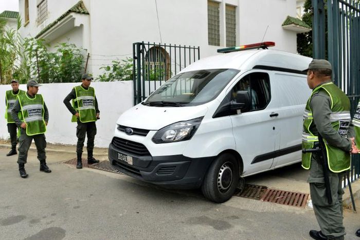 A van carrying suspects in the murder of two Scandinavian hikers enters the court house in Sale, Morocco on June 27, 2019