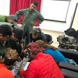 Mountaineers and rescuers study a map of Nanda Devi in an effort to pinpoint the location of the missing climbers on June 3, 2019