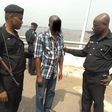 Police officers take a man into custody after a failed suicide attempt on the Third Mainland Bridge in January 2019 [RRS]