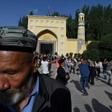 Uighur men dance after Eid al-Fitr prayers in Kashgar, in China's western Xinjiang region