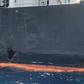 A picture taken during a guided tour by the US Navy (NAVCENT) shows the damage in the hull of the Japanese oil tanker Kokuka Courageous off the port of the Gulf emirate of Fujairah on June 19, 2019