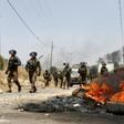 Israeli security forces take position during a weekly demonstration by Palestinians against the expropriation of their lands by Israel in the village of Kfar Qaddum, near Nablus in the occupied West Bank