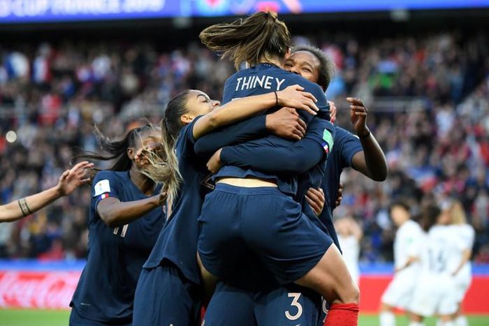 Wendie Renard is jumped on by her teammates after scoring one of her two goals in France's 3-0 win over South Korea on Friday as the Women's World Cup kicked off in Paris