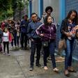 People queue in front of the Telecommunications Workers Union, where a weekly job fair takes place in Rio de Janeiro -- there are 13 million unemployed in Brazil