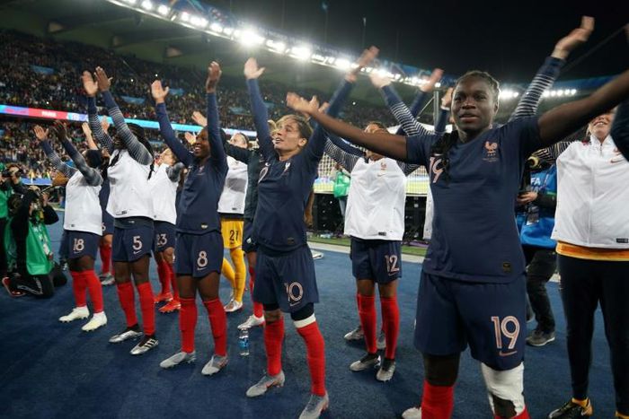 French players celebrate their win over South Korea in the opening game of the women's World Cup on Friday