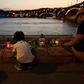 Candles have been lit close to the Danube in memory of the victims