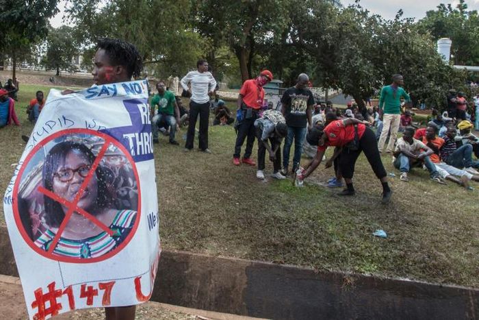 A protester in July carries a banner calling for the ousting of Malawi Electoral Commission chairwoman Jane Ansah