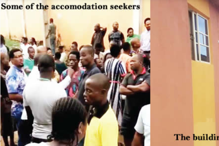 Some of the victims left stranded in front od the building (Punch)