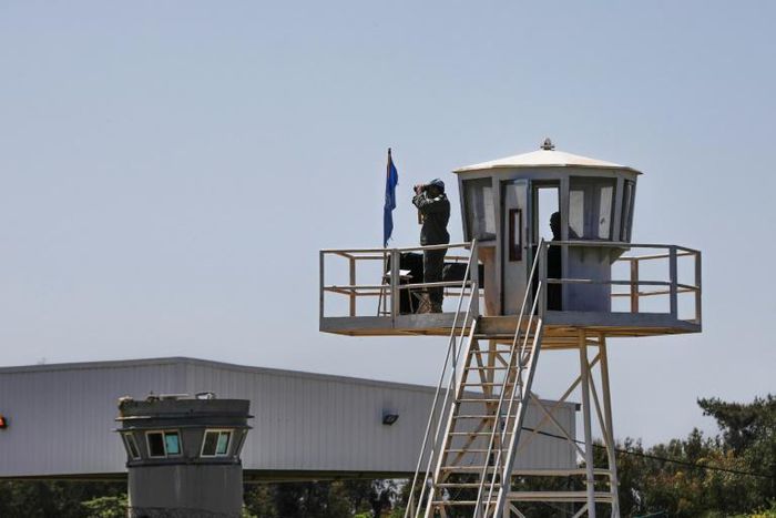 UN peacekeepers observe the Quneitra border crossing with Syria in the Israeli annexed-Golan Heights in this 2018 picture. Israel has carried out hundreds of air strikes in Syria, most of them against what it says are Iranian and Hezbollah targets