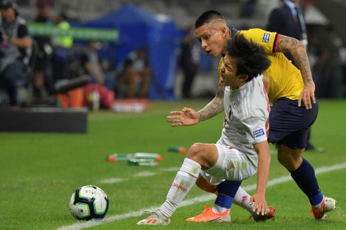 Japan's Takefusa Kubo and Ecuador's Cristian Ramirez vie for the ball during their Copa America draw at the Mineirao Stadium in Belo Horizonte