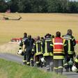 Firefighters head to the site where an army helicopter crashed in Aerzen, northern Germany, killing the pilot July 1, 2019