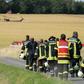 Firefighters head to the site where an army helicopter crashed in Aerzen, northern Germany, killing the pilot July 1, 2019