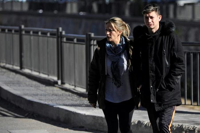 Argentinian Ezequiel Villalonga (R), 18, a victim of sexual abuse, walks with his mother Natalia along a street in Mendoza, Argentina