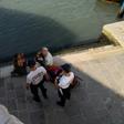 A handout picture released on July 19, 2019 by the city of Venice shows Italian police officers addressing two German tourists after they were caught preparing coffee in front of the Rialto Bridge (Ponte de Rialto) in Venice, Italy; the two were fined ...