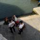A handout picture released on July 19, 2019 by the city of Venice shows Italian police officers addressing two German tourists after they were caught preparing coffee in front of the Rialto Bridge (Ponte de Rialto) in Venice, Italy; the two were fined ...