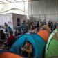 People live in tents in the crowded Juventud 2000 migrant shelter in Tijuana, Mexico