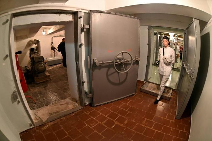 Visiting the underground shelter of the Chernobyl nuclear power plant, during a tour in the Chernobyl exclusion zone, where the first meetings of the official commission that handled the consequences of the disaster took place in April 1986.