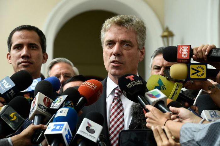 Germany's ambassador to Venezuela, Daniel Kriener, is seen here speaking to the press in February 2019 alongside opposition leader Juan Guaido (left)