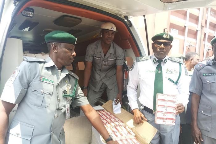 The Customs Area Controller of Apapa Command,  Comptroller Mohammed Abba-Kura  displaying the 10 cartons intercepted tramadol of 225mg in an ambulance which was arrested by the command [NAN]