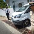 Moroccan security personnel stand guard as a car transporting the suspected killers leaves the court in Sale on May 16