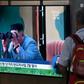 A television at a railway station in Seoul on July 31 shows footage of North Korean leader Kim Jong Un watching a previous missile launch